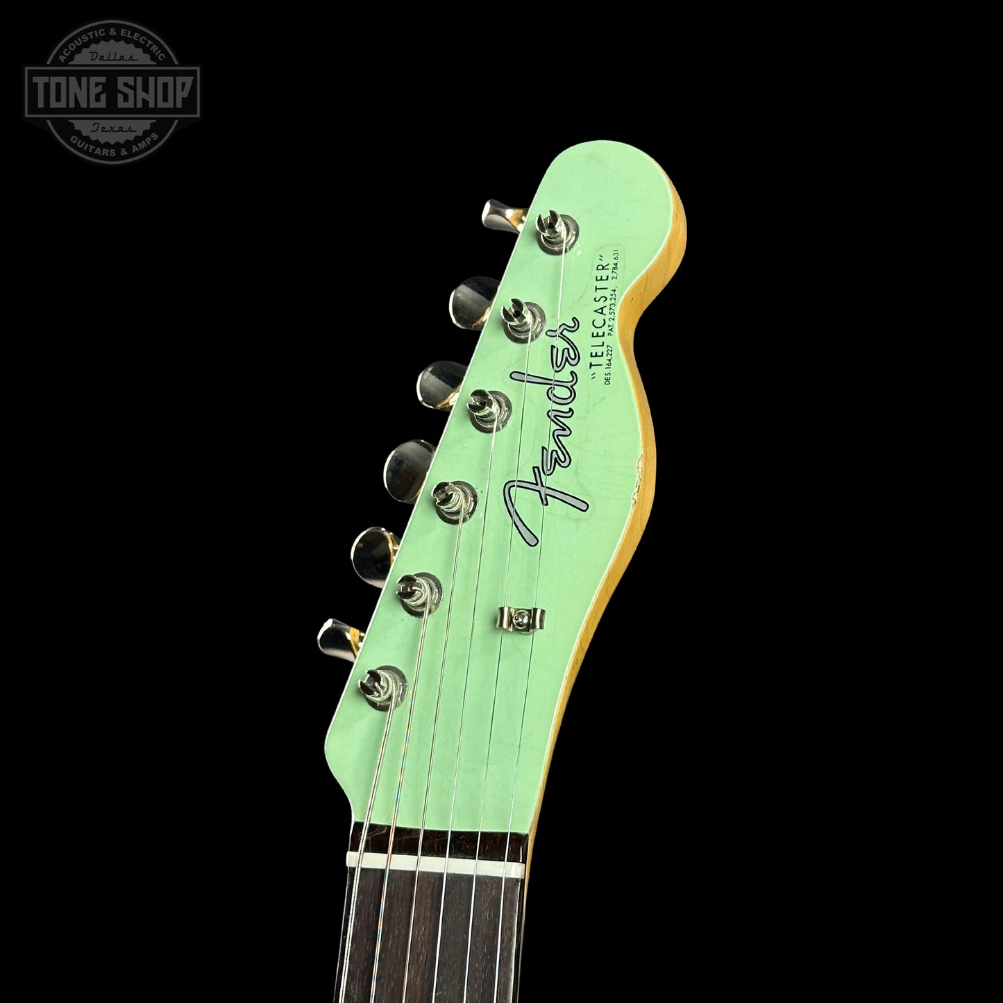 Headstock of Fender Custom Shop 1963 Telecaster Journeyman Relic Aged Surf Green.