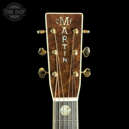 Close-up of a Martin guitar headstock with 'Tone Shop' logo in the corner.