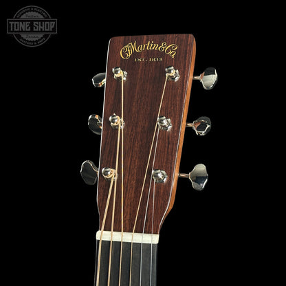 Martin guitar headstock with brand logo on a black background