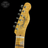 Close-up of a Fender Telecaster guitar headstock on a black background