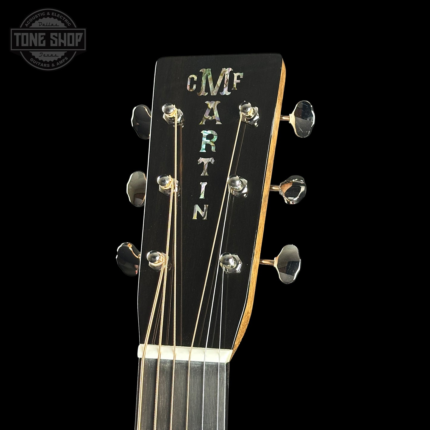 Headstock of Martin Custom Shop 000 14-Fret Quilted Maple.