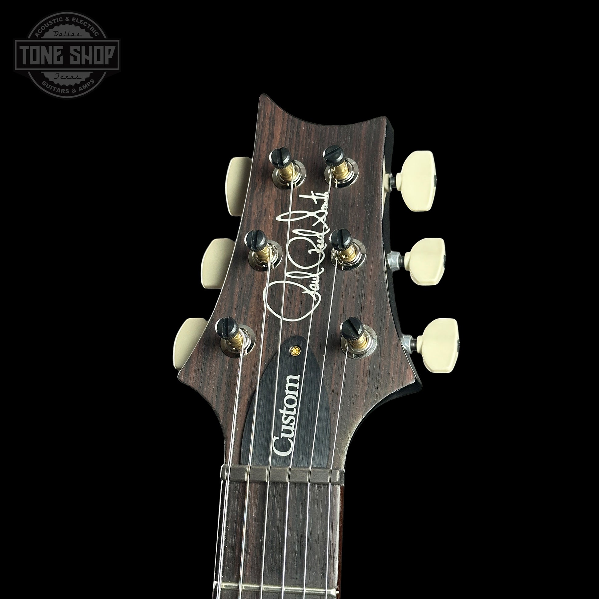 Headstock of PRS Custom 24 10 Top Purple Mist.