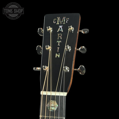 Guitar headstock with 'C.F. Martin' branding on a black background