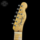 Fender Telecaster guitar headstock on a black background