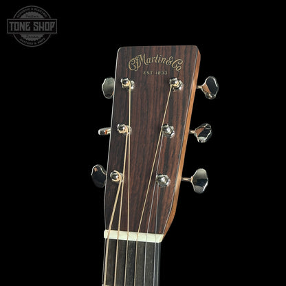 Guitar headstock with 'Martin & Co' branding on a black background