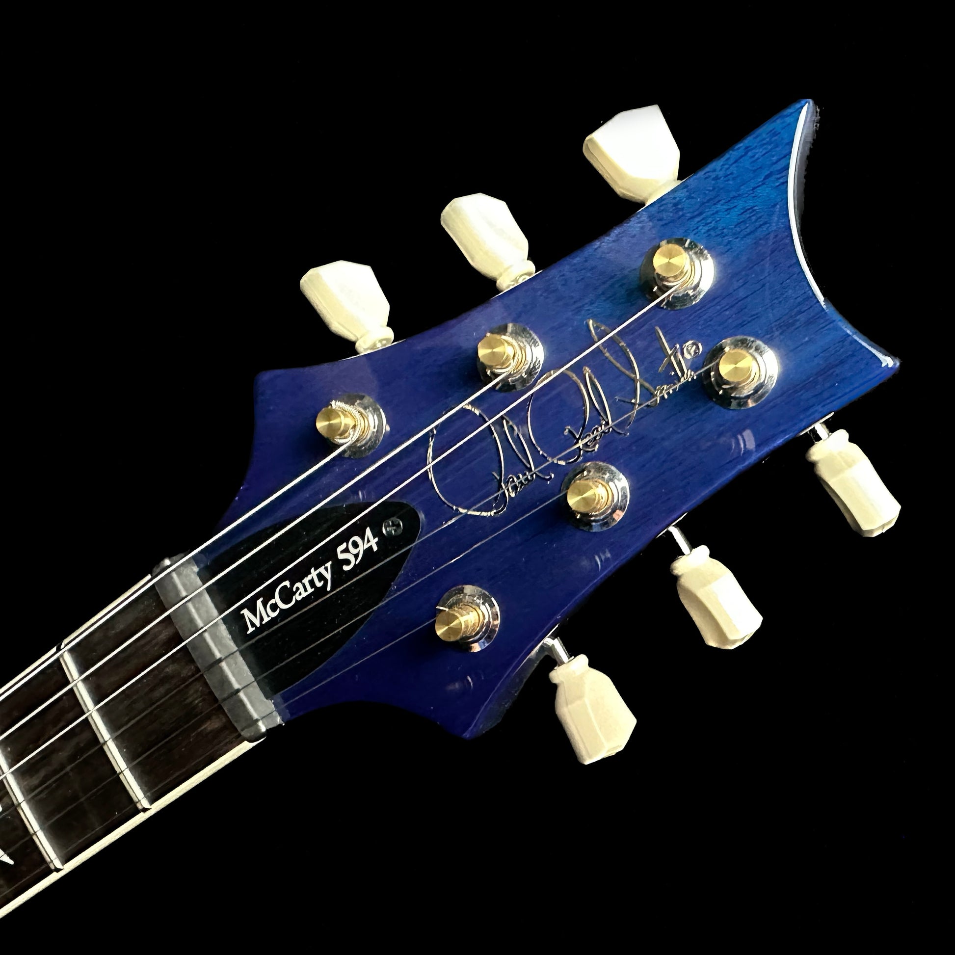 Closeup of PRS Paul Reed Smith S2 McCarty 594 Quilt Faded Gray Black Blue Burst headstock.