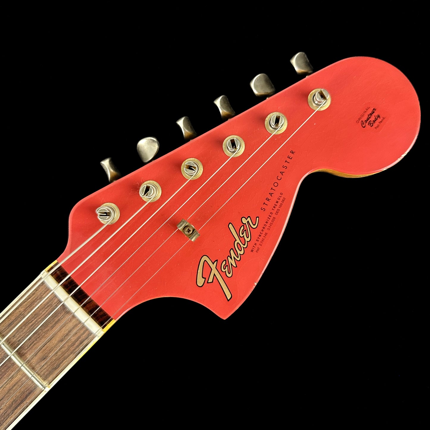 Closeup of Fender Custom Shop Limited 67 Stratocaster Heavy Relic Aged Fiesta Red/3-Tone Sunburst headstock.