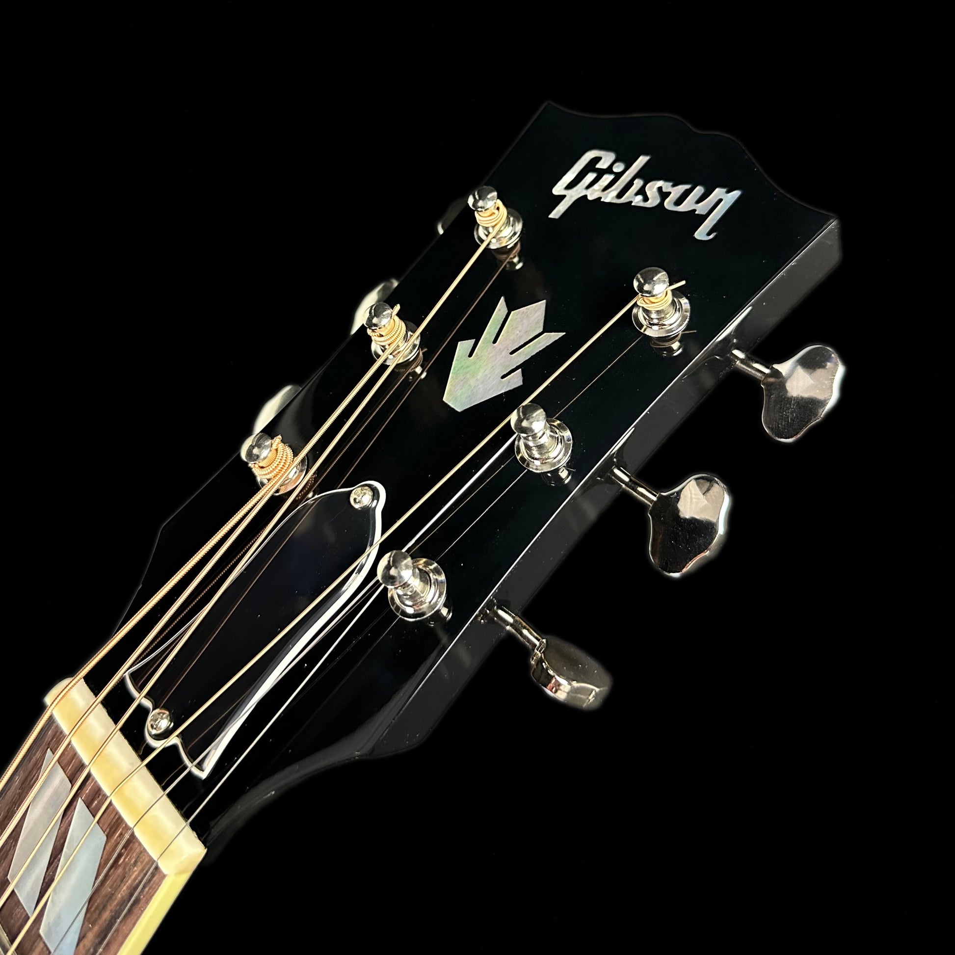 Close up of Gibson Custom Shop M2M Southern Jumbo Original Ebony headstock.