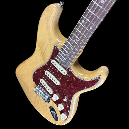 Front angle of Fender Custom Shop American Custom Strat NOS RW Amber Natural.