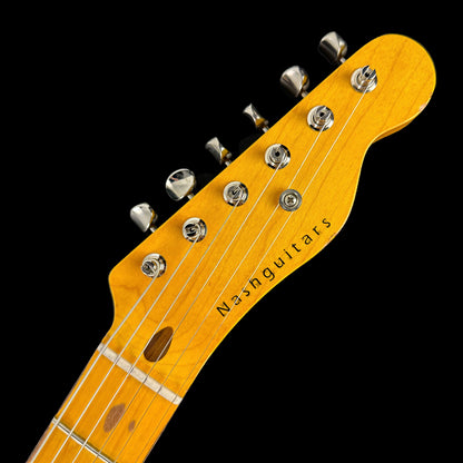 Close up of Nash T-52 Butterscotch Blonde Light Aging Ash/MP headstock.