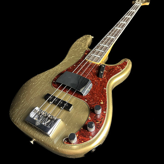 Front angle of Fender Custom Shop Limited Edition P Bass Special Journeyman Relic Aged Aztec Gold.
