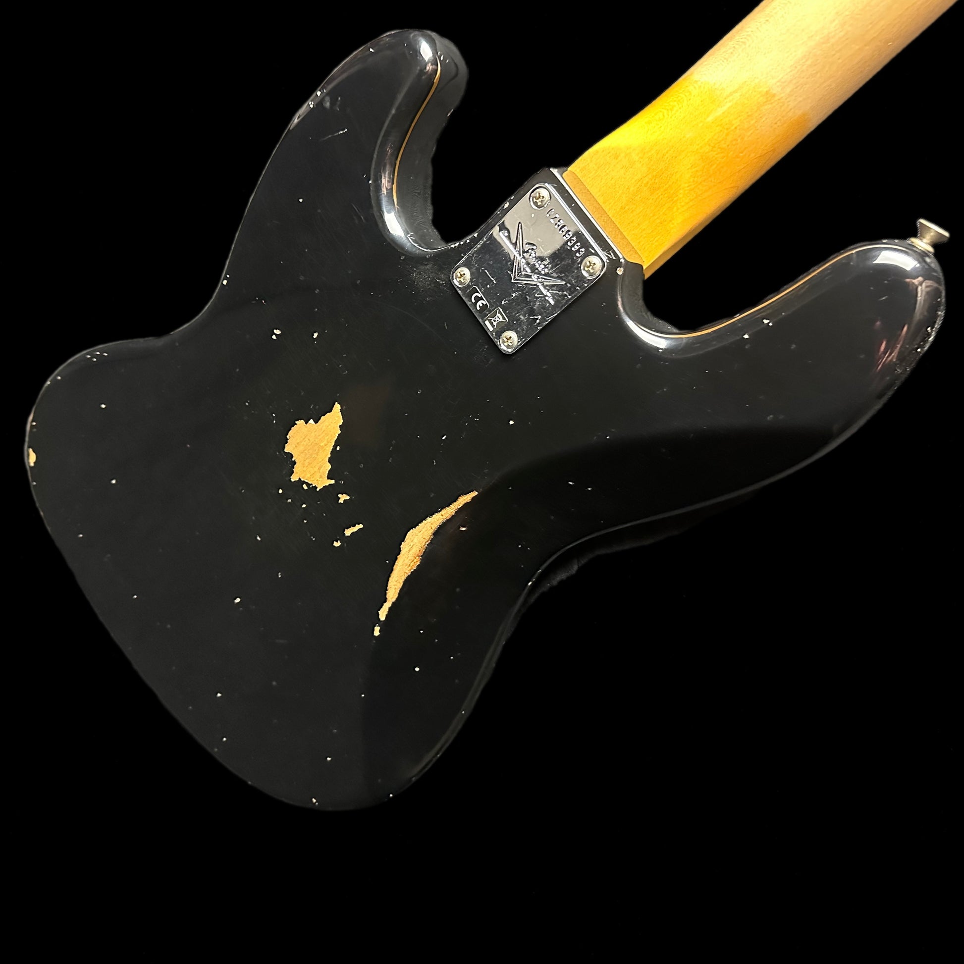 Back angle of Fender Custom Shop 1962 Jazz Bass Relic Aged Black.