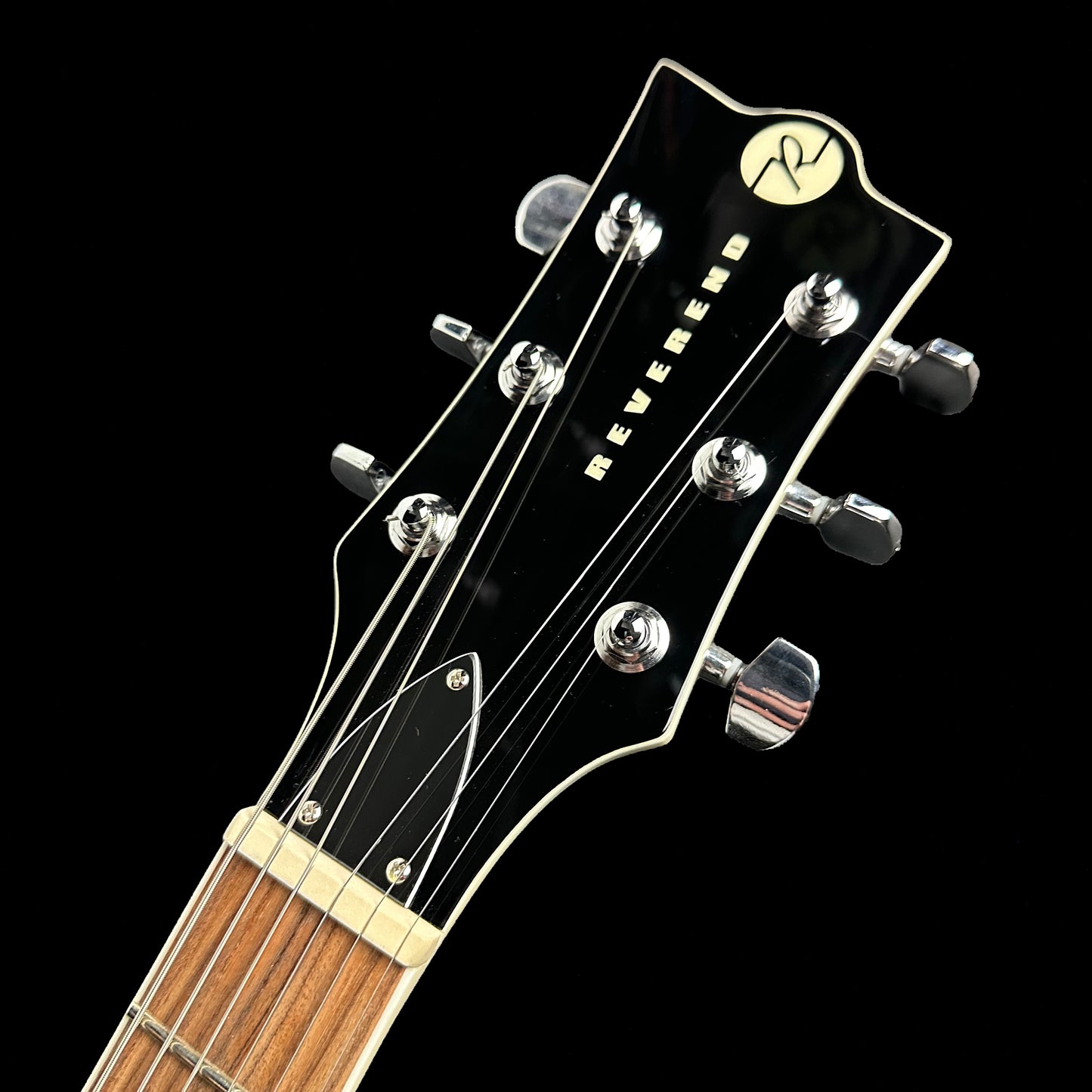 Close up angle of Reverend Roundhouse Deep Sea Blue headstock.