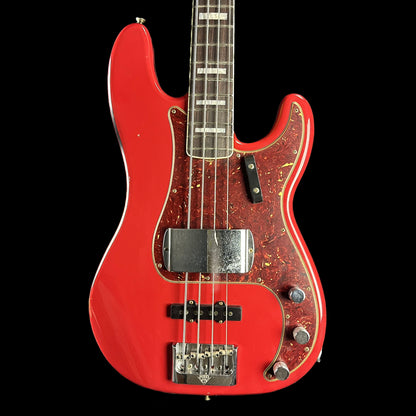Front of Fender Custom Shop Limited Edition P Bass Special Journeyman Relic Aged Dakota Red.