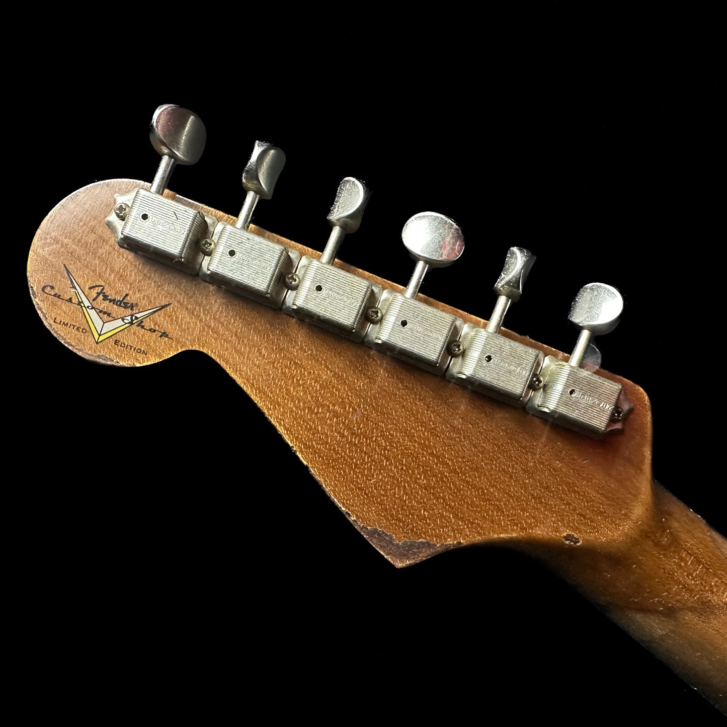 Back of Fender Custom Shop Limited Edition Roasted '61 Strat - Super Heavy Relic Aged Black over 3-color Sunburst headstock.