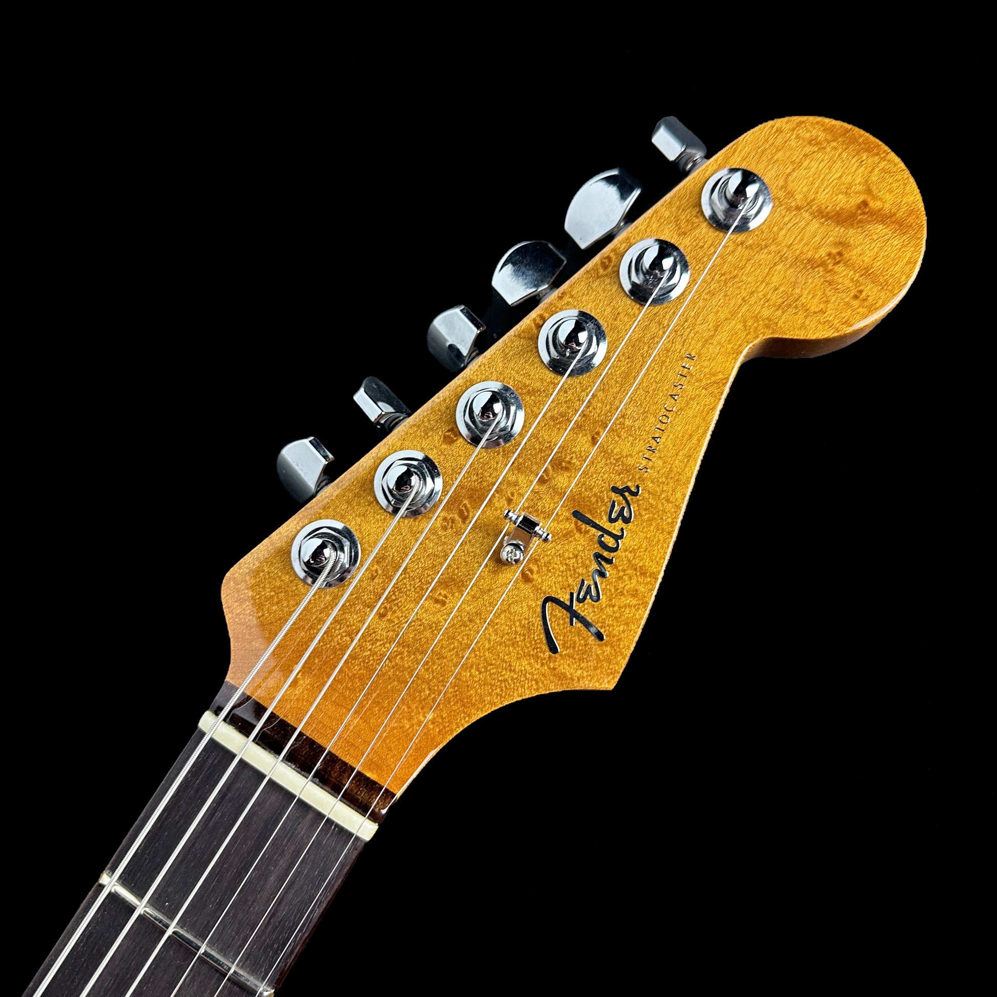 Closeup of Fender Custom Shop American Custom Strat NOS RW Chocolate 3-Color Sunburst headstock.