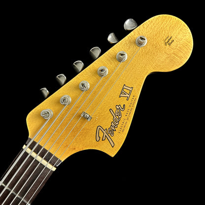 Close up of Fender Custom Shop Bass VI Journeyman Relic Vintage White headstock.