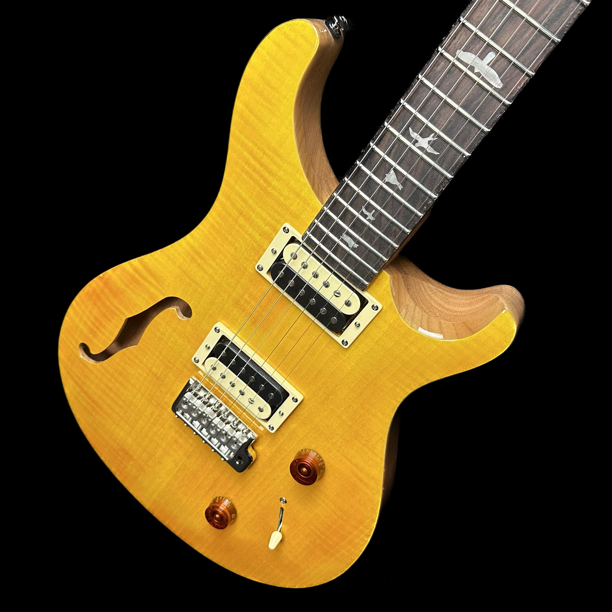 Top down angle of PRS Paul Reed Smith SE Custom 22 Semi-Hollow Santana Yellow body.