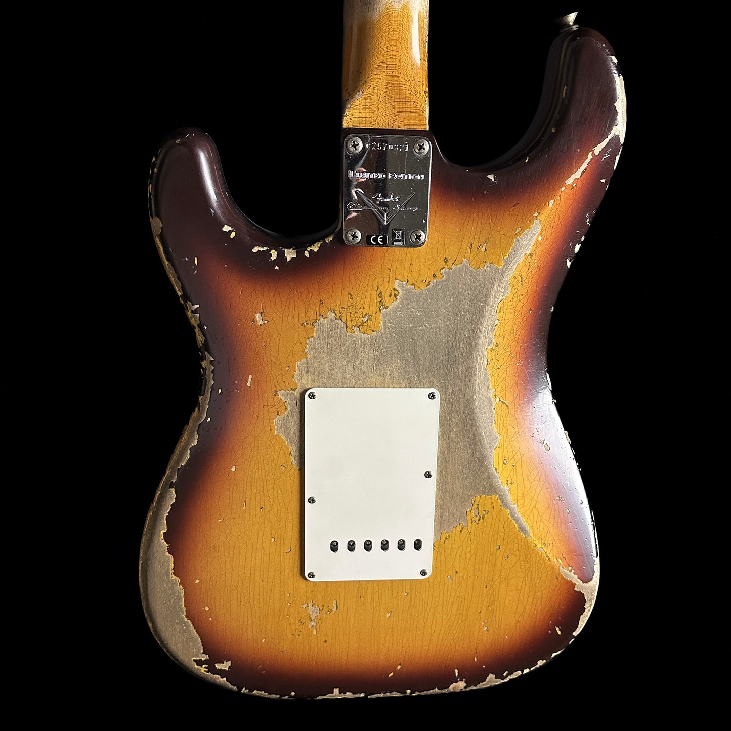 Back of Fender Custom Shop Limited Edition '59 Strat Super Heavy Relic Super Faded Aged Chocolate 3-color Sunburst.