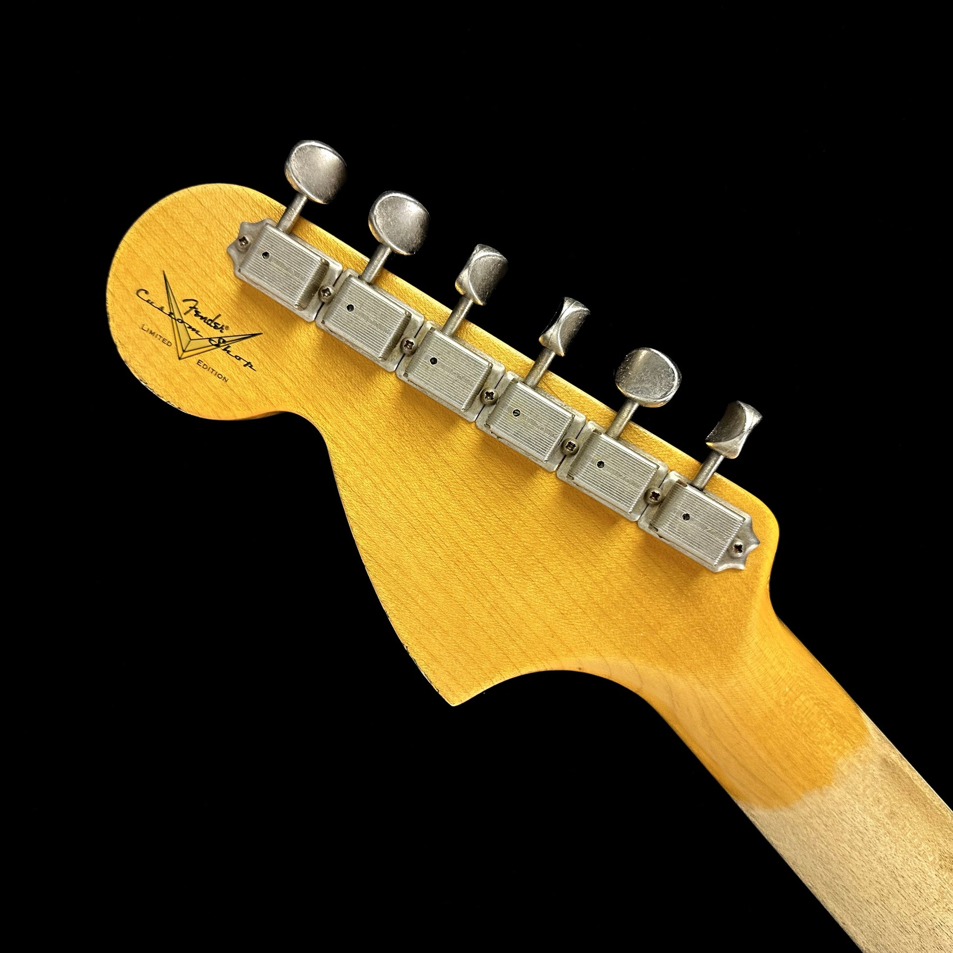 Back of Fender Custom Shop Limited 67 Stratocaster Heavy Relic Aged Fiesta Red/3-Tone Sunburst headstock.