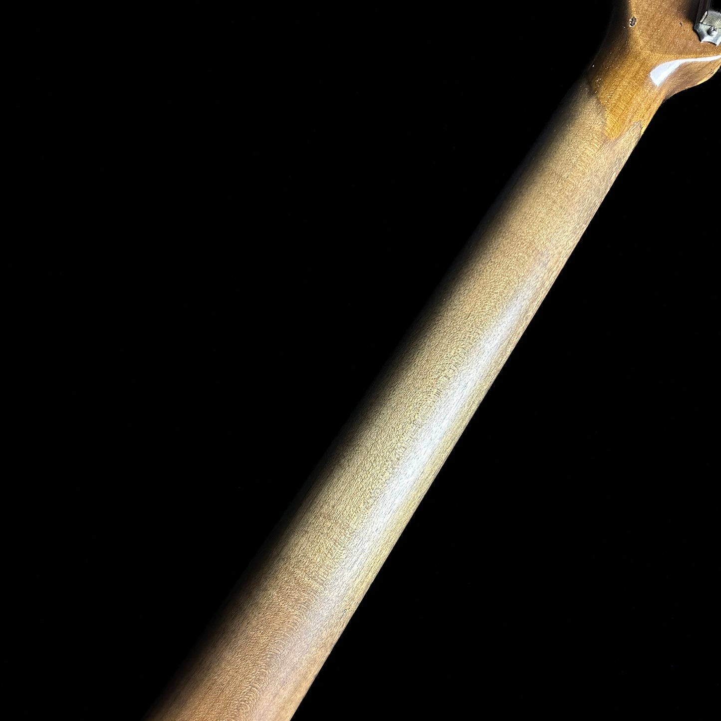 Back of Fender Custom Shop Limited Edition Roasted '61 Strat - Super Heavy Relic Aged Black over 3-color Sunburst neck.