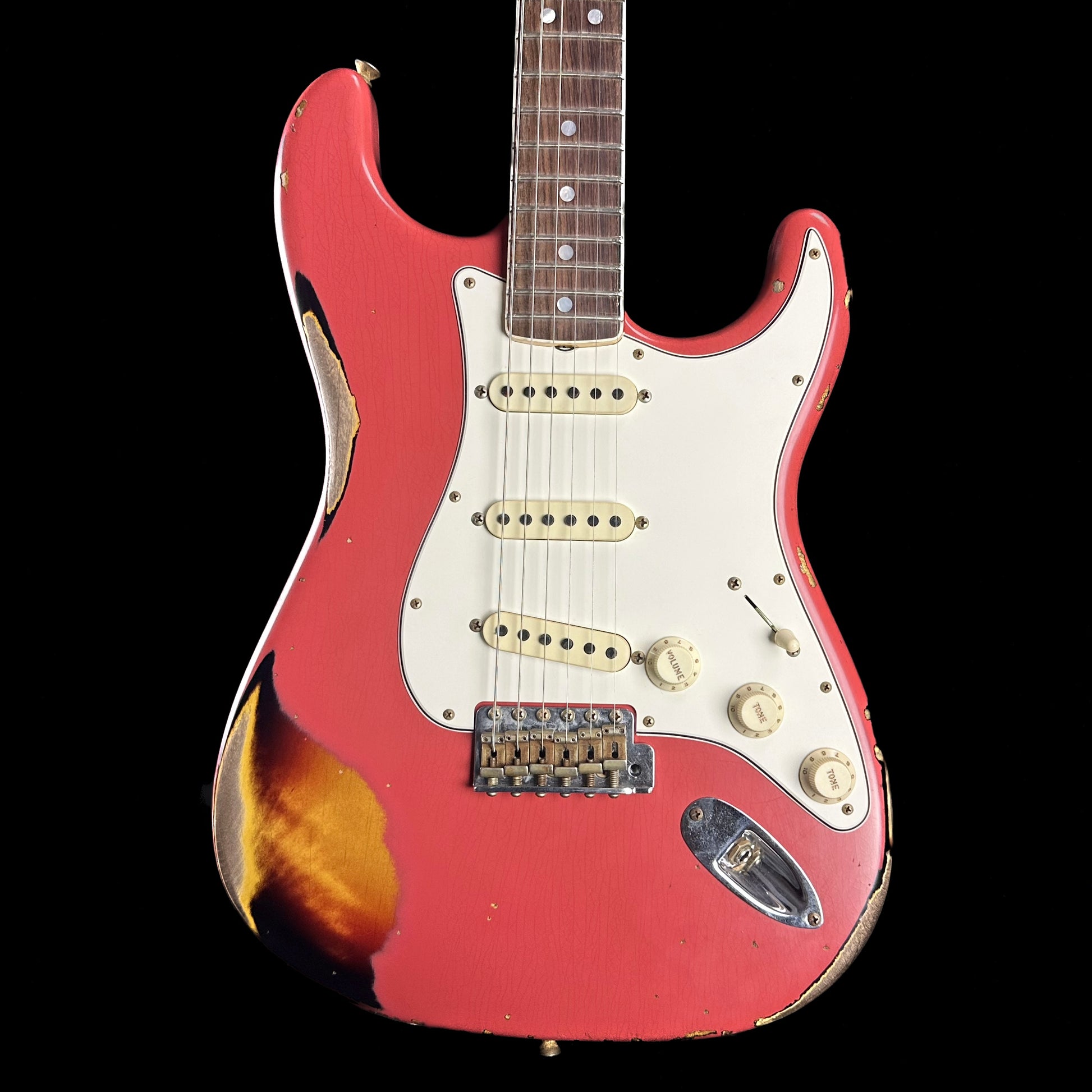 Front of Fender Custom Shop Limited 67 Stratocaster Heavy Relic Aged Fiesta Red/3-Tone Sunburst.