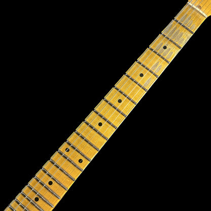 Closeup of Fender Custom Shop 58 Strat Relic Faded Aged Chocolate 3-color Sunburst fretboard.