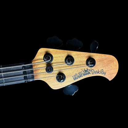 Close up of Ernie Ball Music Man DarkRay Bass Obsidian Black headstock.