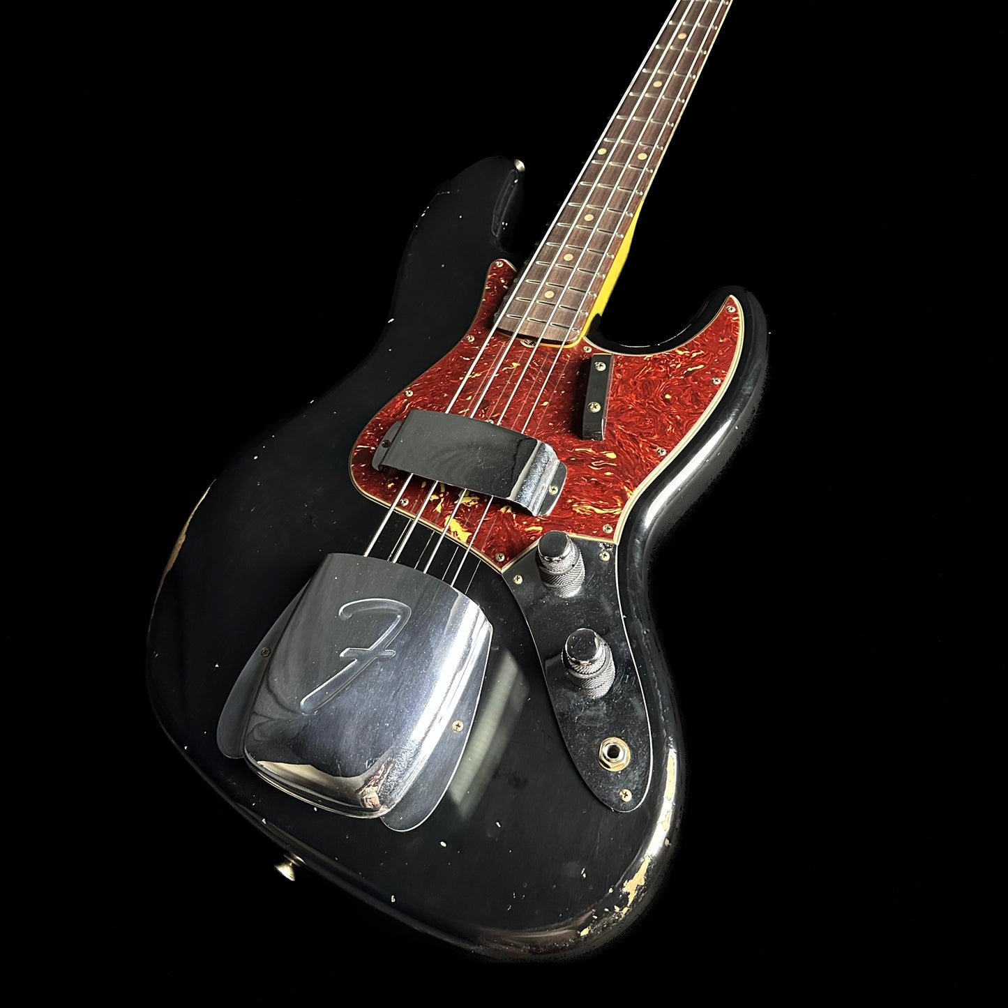 Front angle of Fender Custom Shop 1962 Jazz Bass Relic Aged Black.