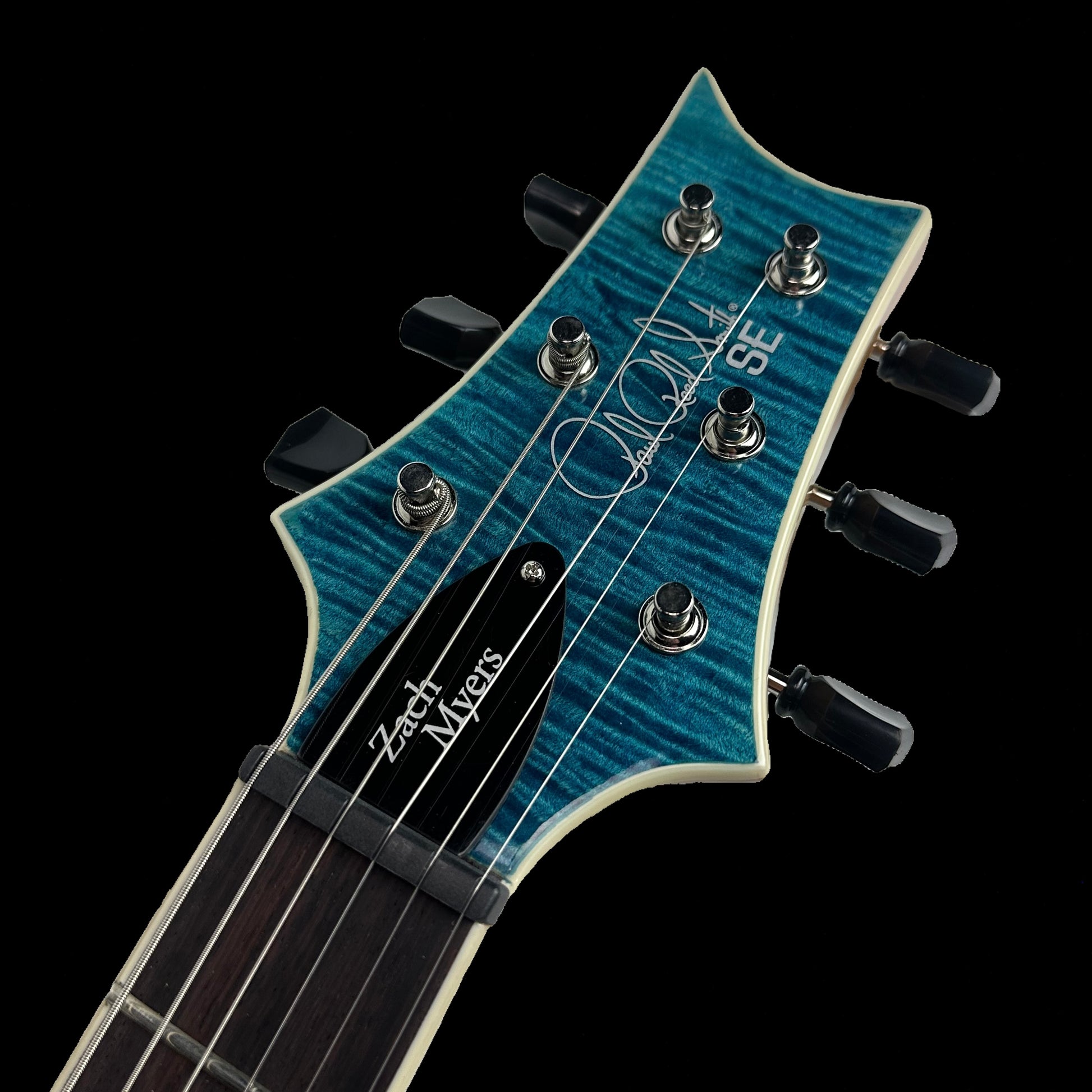 Close up of PRS Paul Reed Smith SE Zach Myers 594 Semi-Hollow Myers Blue headstock.
