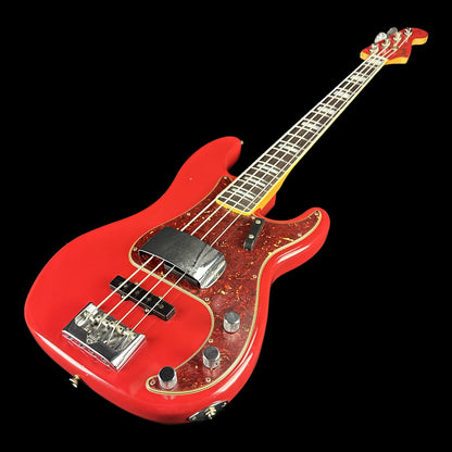 Front angle of Fender Custom Shop Limited Edition P Bass Special Journeyman Relic Aged Dakota Red.
