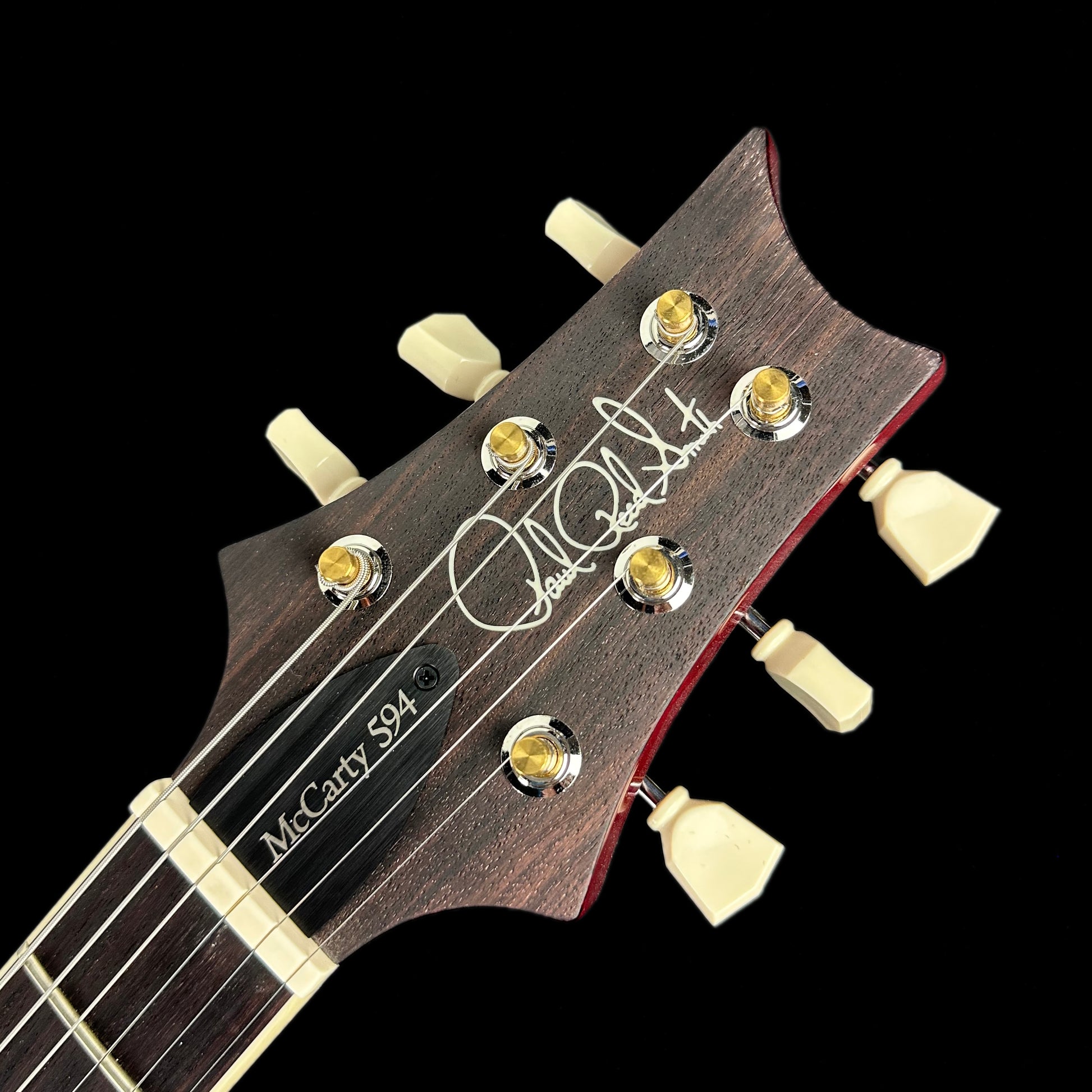 Close up of PRS McCarty 594 Hollowbody II Charcoal Cherry Burst Birds headstock.