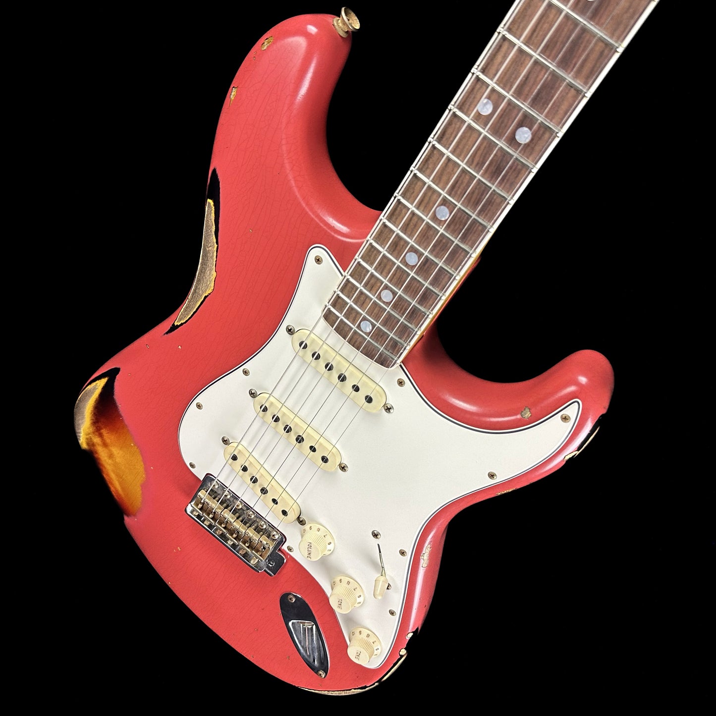 Front angle of Fender Custom Shop Limited 67 Stratocaster Heavy Relic Aged Fiesta Red/3-Tone Sunburst.