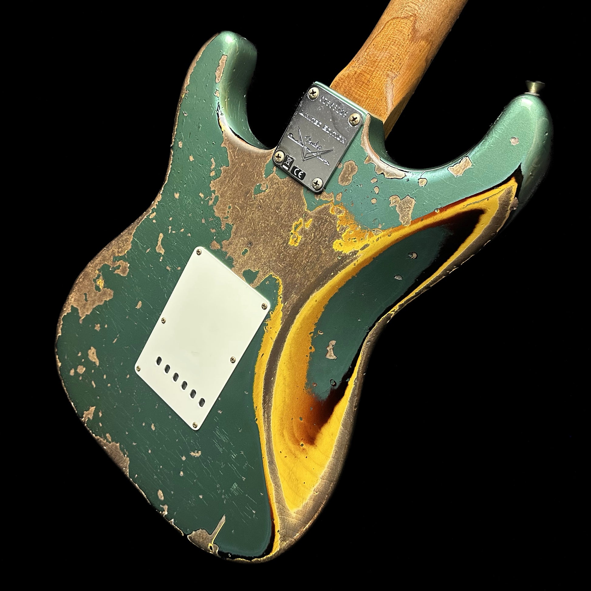 Top down angle of Fender Custom Shop  Limited Edition Roasted 1961 Stratocaster Super Heavy Relic Aged Sherwood Green Metallic/3TSB back.