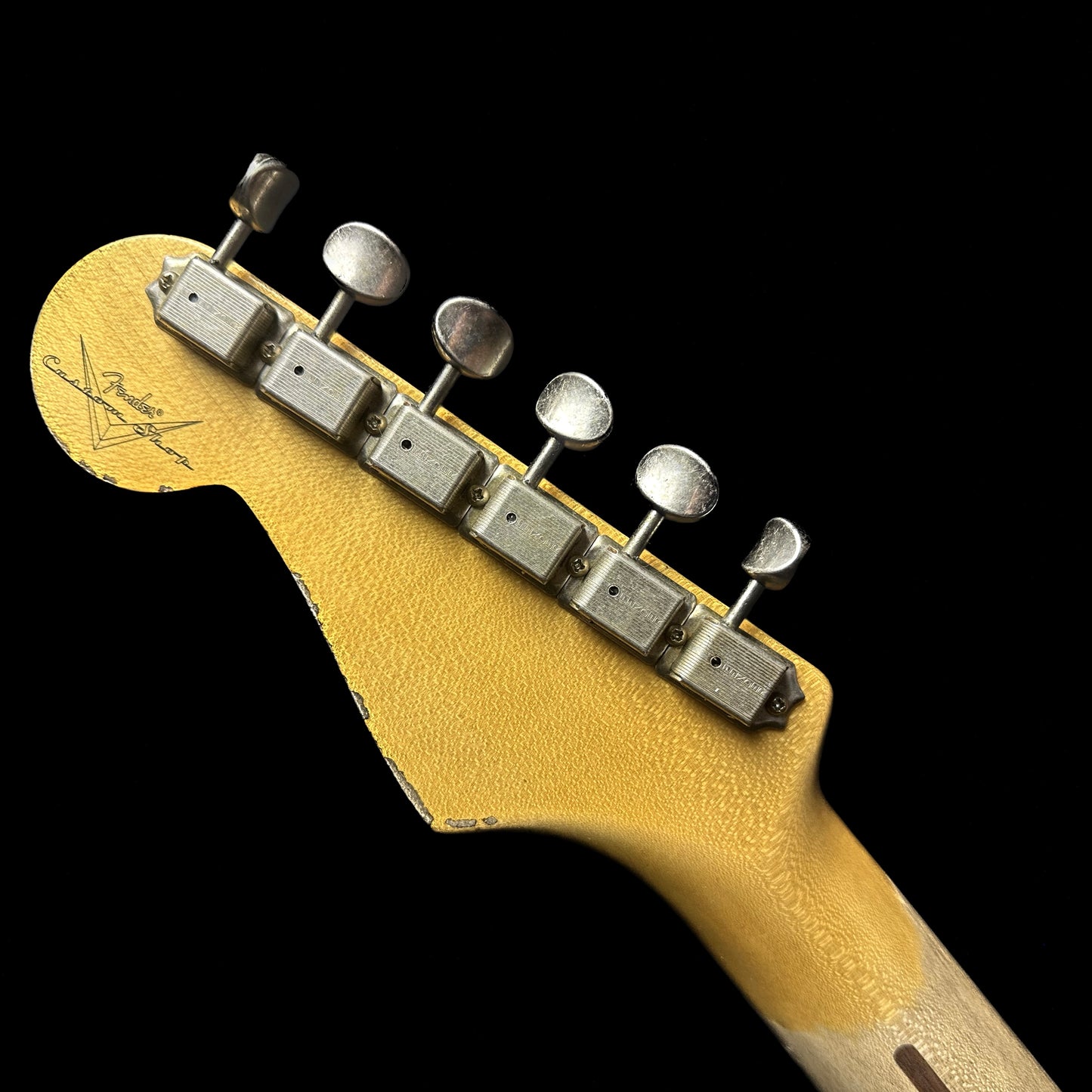 Back of Fender Custom Shop 58 Strat Relic Faded Aged Chocolate 3-color Sunburst headstock.