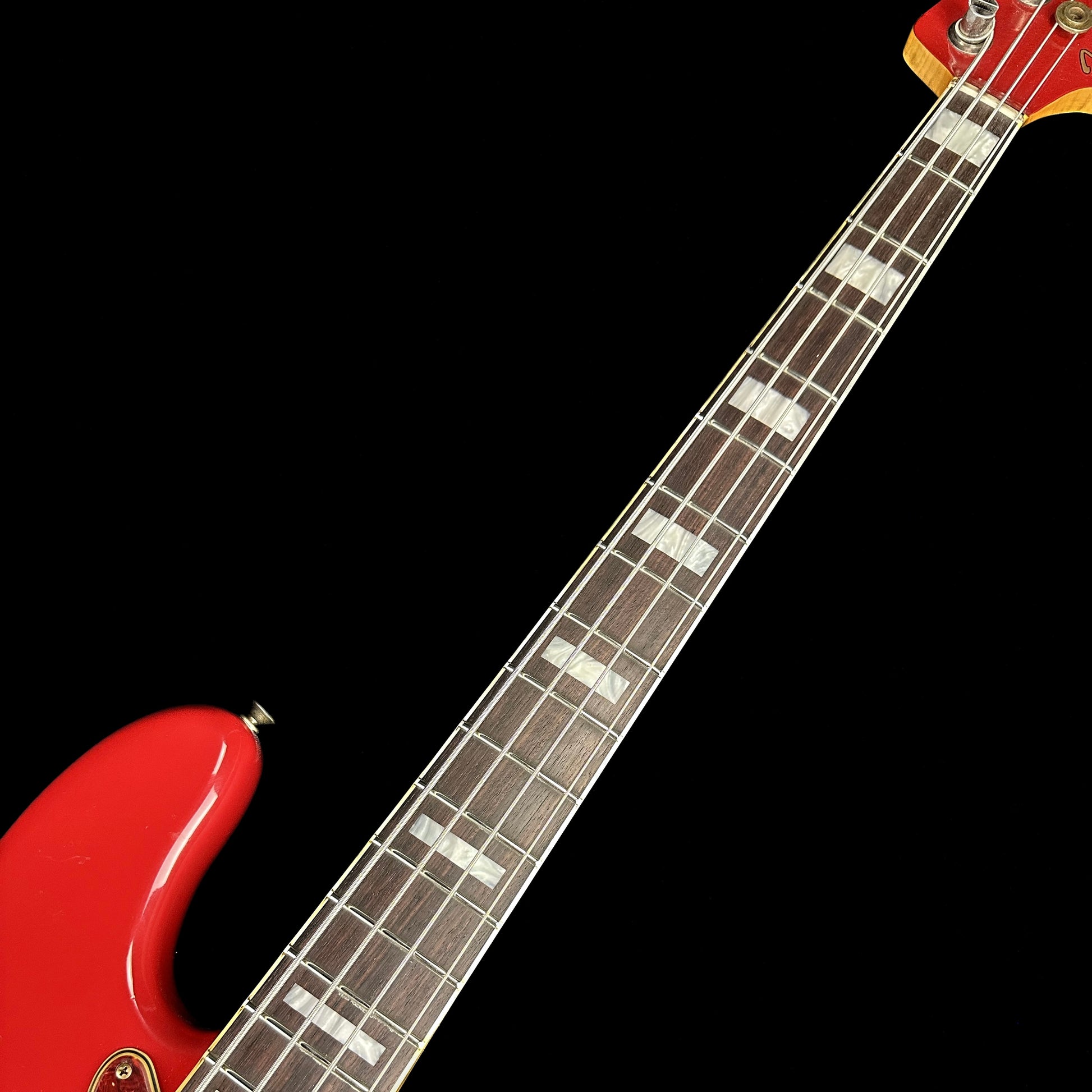 Closeup of Fender Custom Shop Limited Edition P Bass Special Journeyman Relic Aged Dakota Red fretboard.