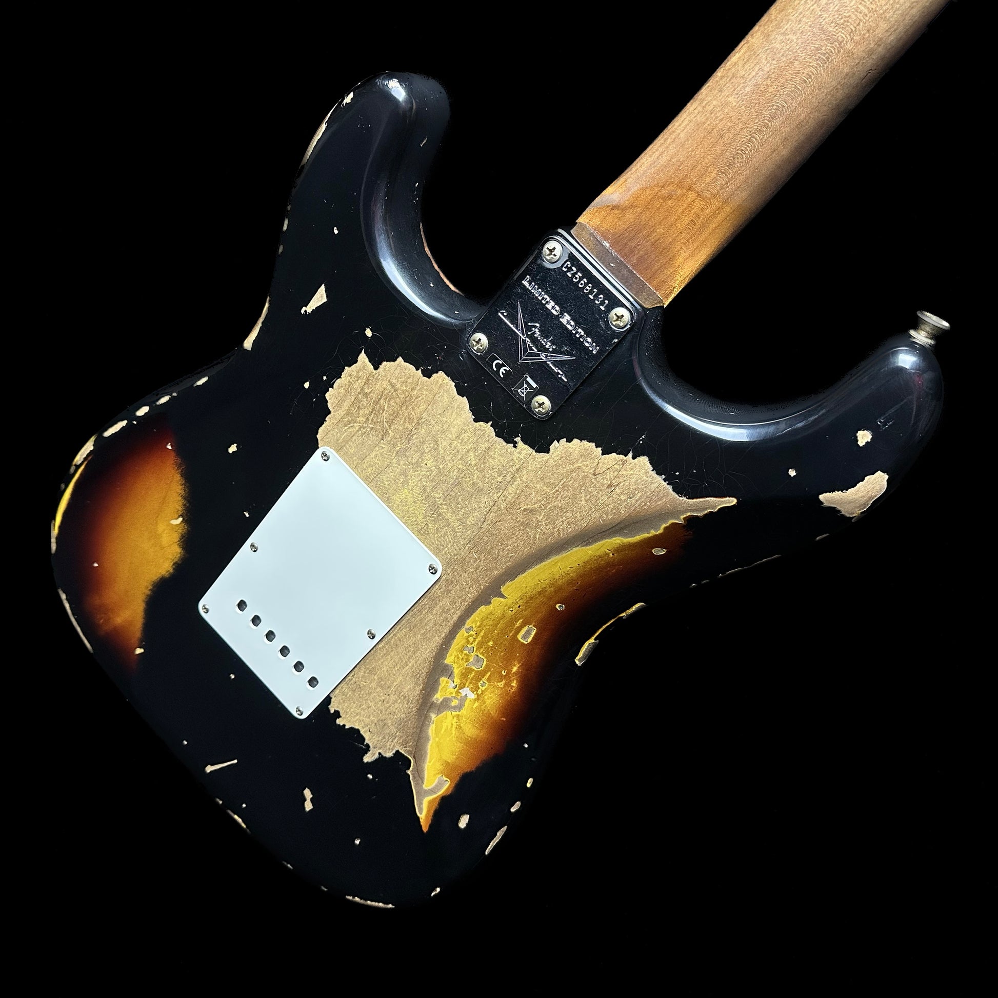 Back angle of Fender Custom Shop Limited Edition Roasted '61 Strat - Super Heavy Relic Aged Black over 3-color Sunburst.