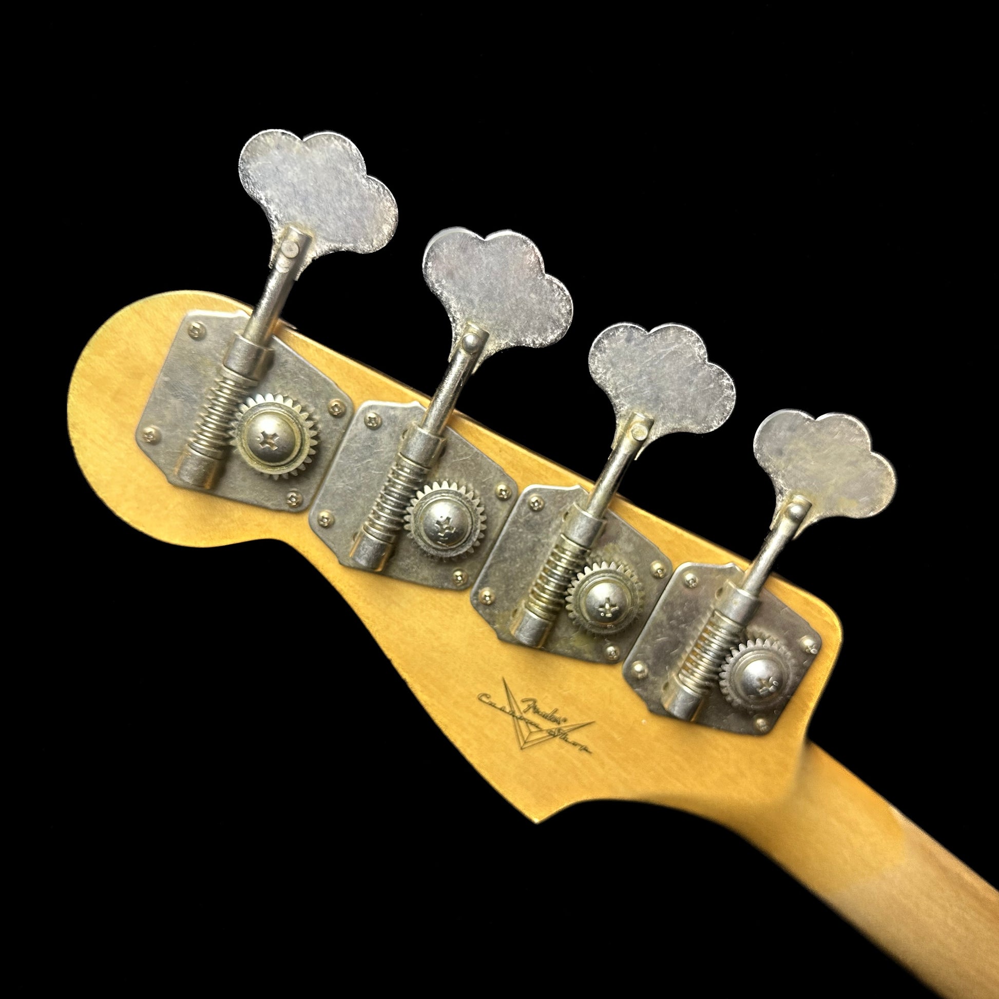Back of Fender Custom Shop 1962 Jazz Bass Relic Aged Black headstock.