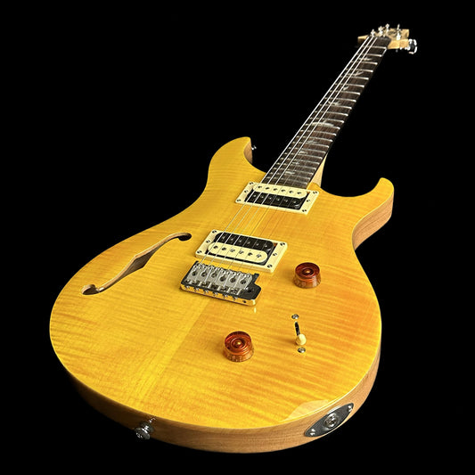 Front angle of PRS Paul Reed Smith SE Custom 22 Semi-Hollow Santana Yellow.
