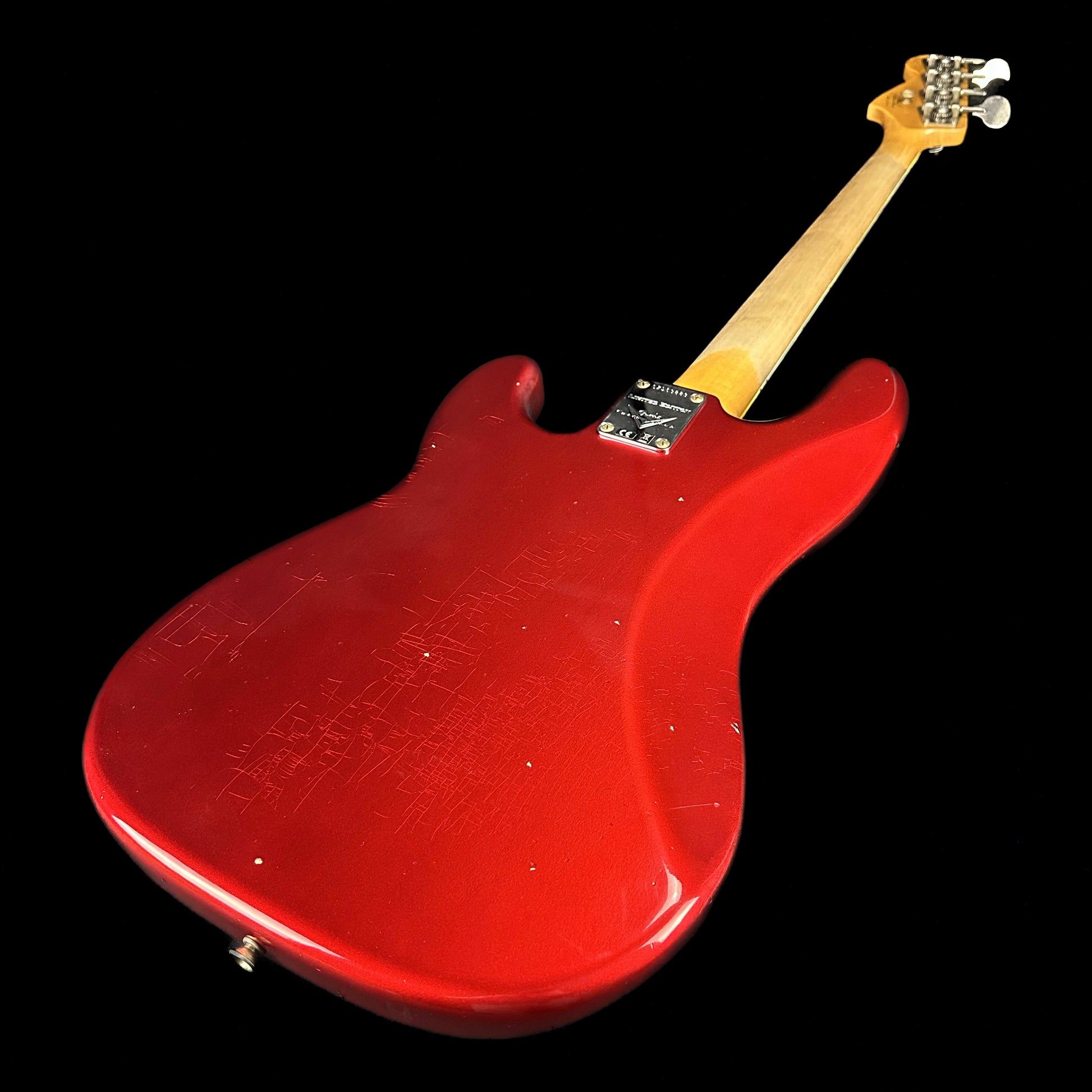 Back angle of Fender Custom Shop Limited P Jazz Bass Journeyman Aged Candy Apple Red.