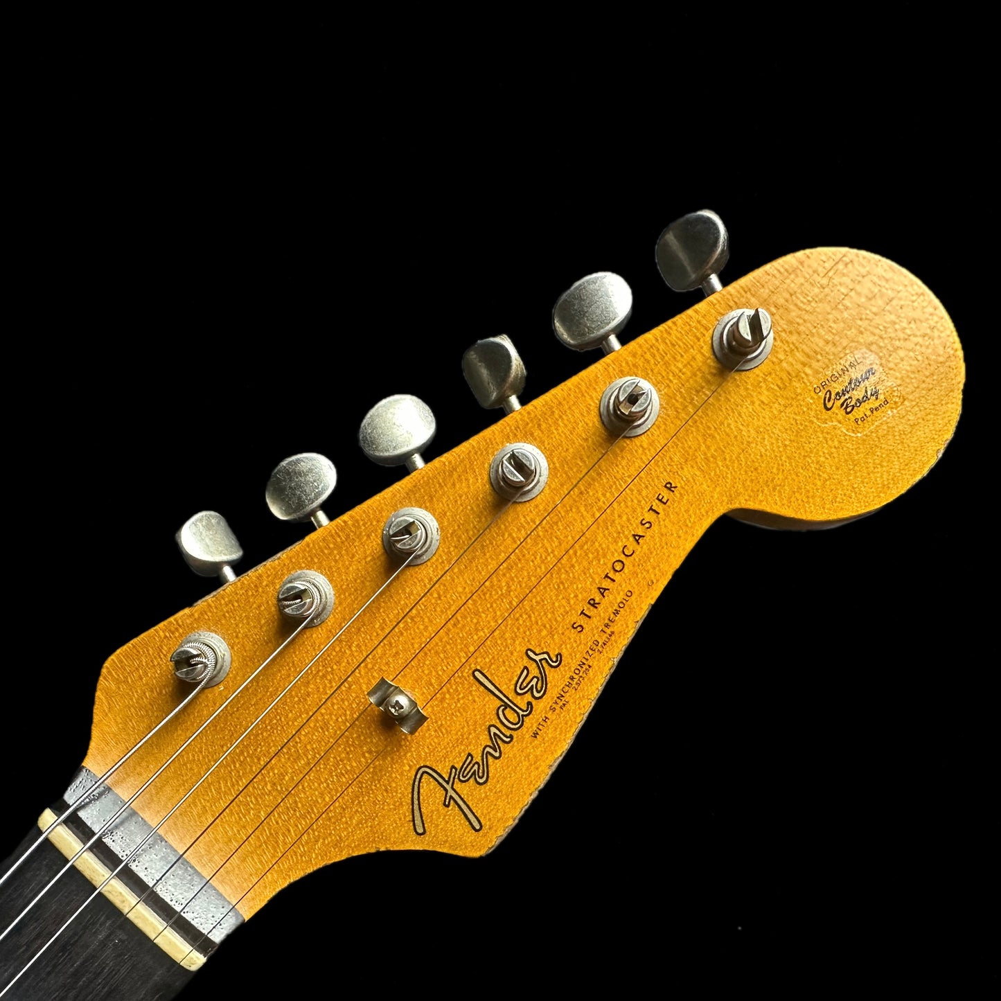 Headstock of Fender Custom Shop Limited Edition '62 Strat Heavy Relic Faded Aged 3 Color Sunburst.