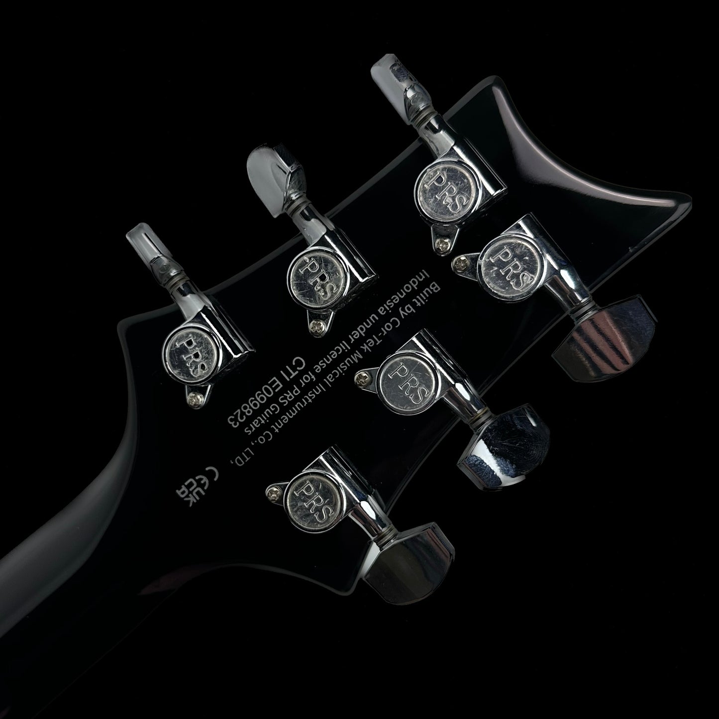 Close up of the back of the headstock of PRS Paul Reed Smith SE 277 Baritone Charcoal Burst.