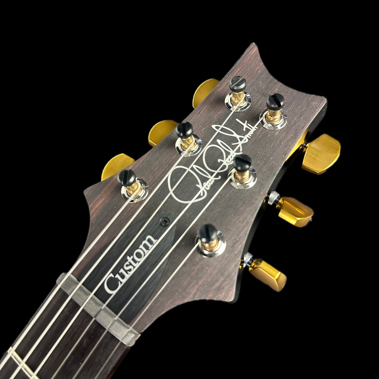 Close up of headstock of PRS Custom 24-08 10 Top Flame Purple Mist.