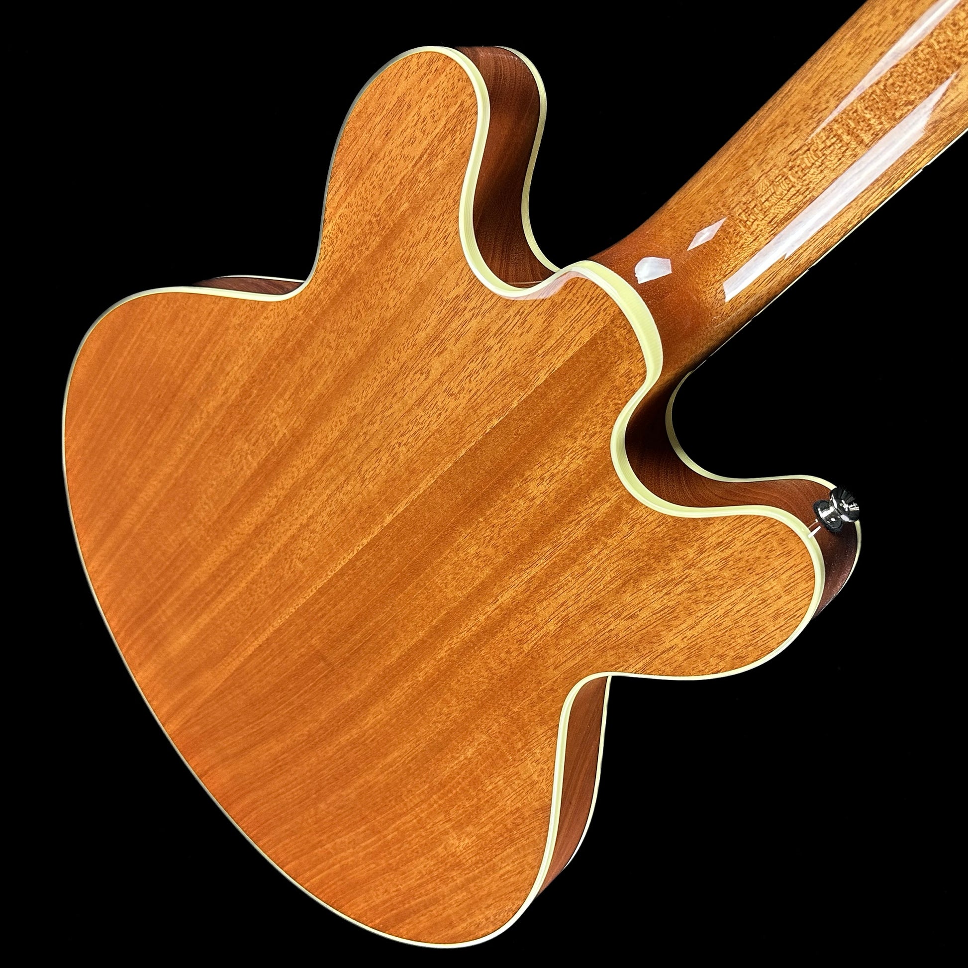 Top down angle of Collings I-35 Deluxe Blonde Flame Top ThroBaks back.