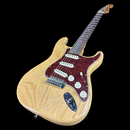 Front angle of Fender Custom Shop American Custom Strat NOS RW Amber Natural.