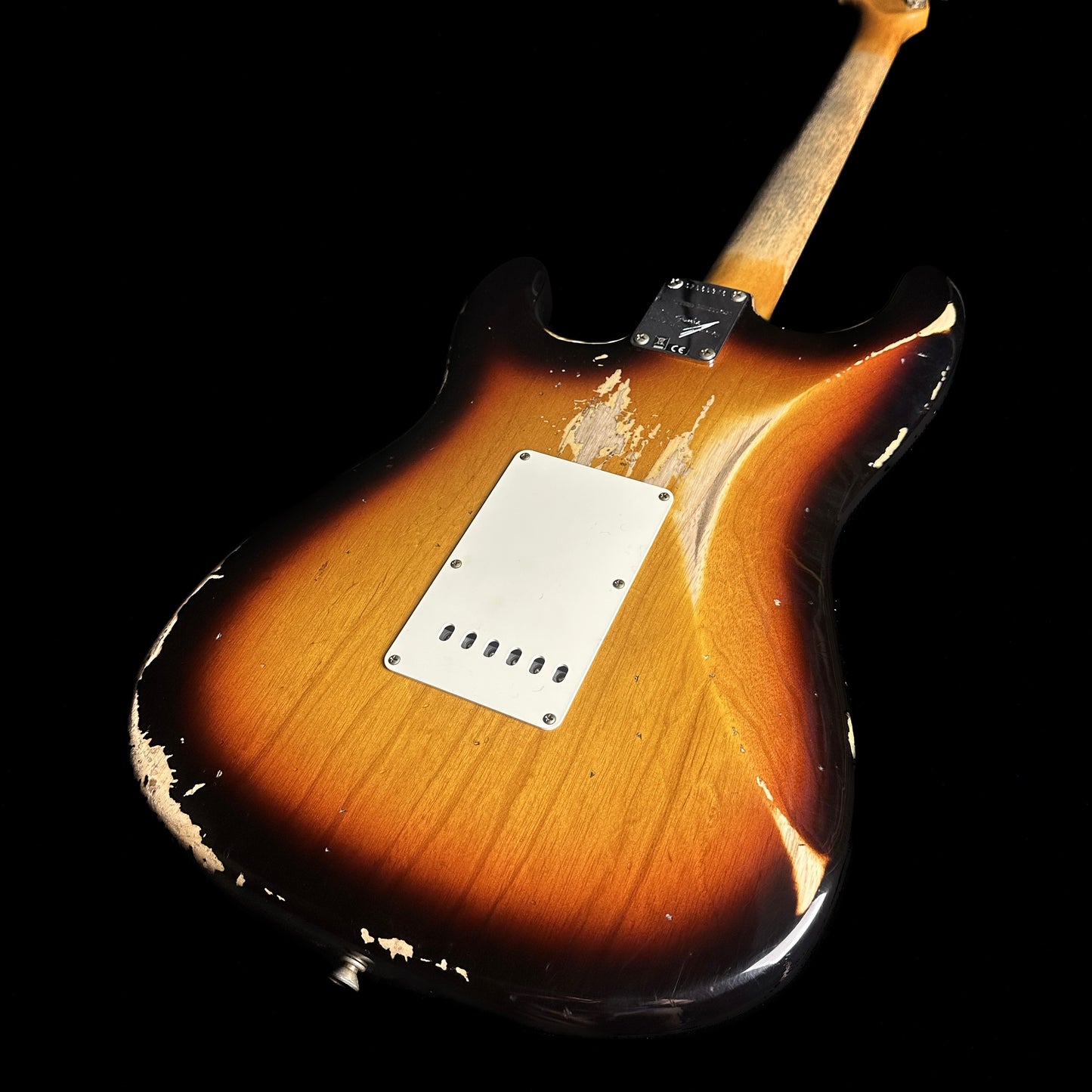 Back angle of Fender Custom Shop Limited Edition '62 Strat Heavy Relic Faded Aged 3 Color Sunburst.