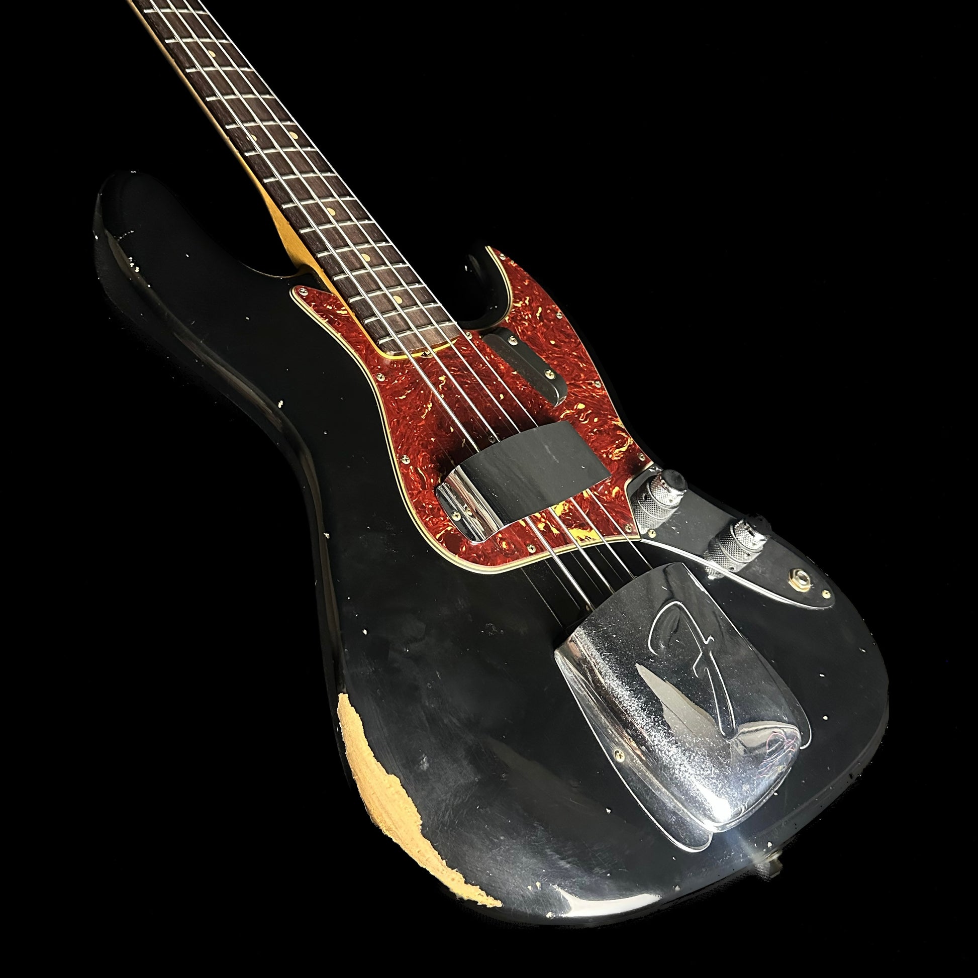 Front angle of Fender Custom Shop 1962 Jazz Bass Relic Aged Black.
