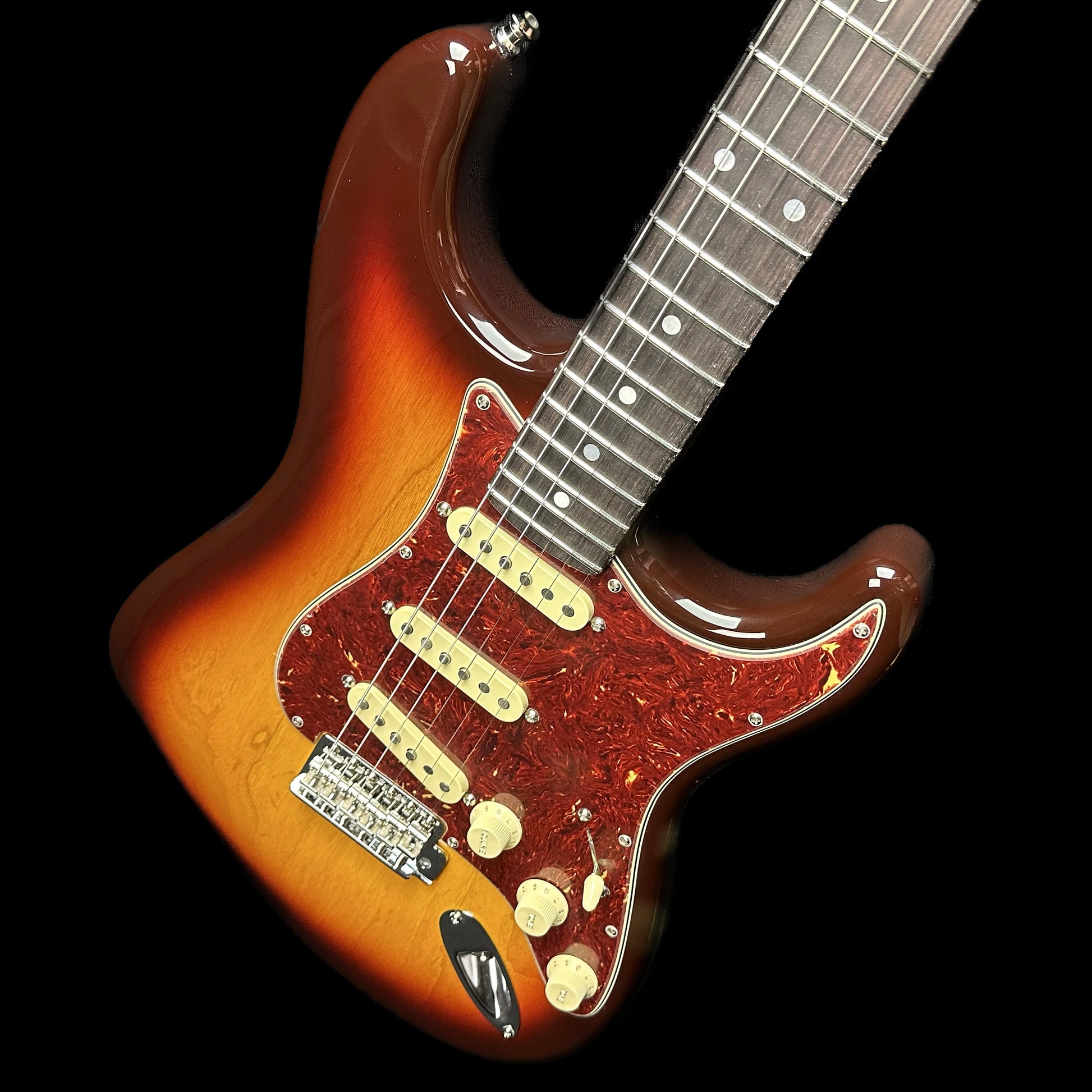 Front angle of Fender Custom Shop American Custom Strat NOS RW Chocolate 3-Color Sunburst.