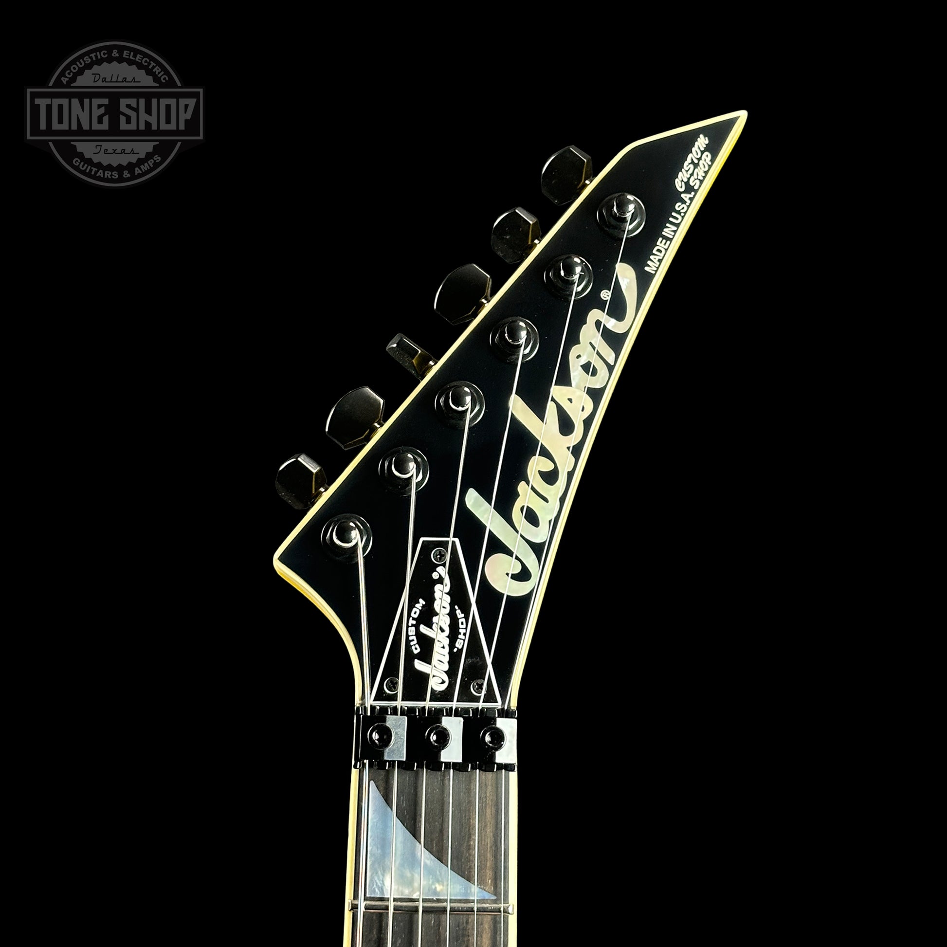 Front of headstock of Jackson Custom Shop SL HSS Floyd Rose Graf Yellow.