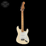 Electric guitar with a cream finish on a black background, featuring the Tone Shop logo.